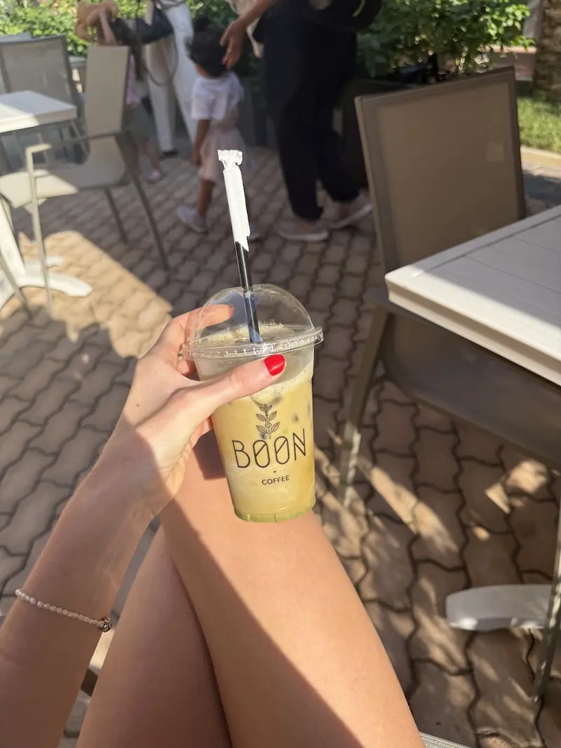 An iced drink in a Boon cup on the terrace