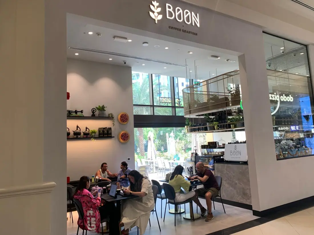 Inside a Boon café, guests at the counter